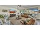 Comfortable living room with a large window offering a view of the outdoor pool area at 18120 W Cassia Way, Goodyear, AZ 85338