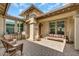 Charming outdoor patio with brick pavers and string lights, perfect for relaxing and entertaining at 18120 W Cassia Way, Goodyear, AZ 85338