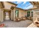 Inviting covered patio featuring a lounge area and views of the desert landscape at 18120 W Cassia Way, Goodyear, AZ 85338