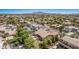 Aerial view of a house with mountain views, gorgeous backyard, and community at 1834 E Scorpio Pl, Chandler, AZ 85249