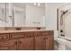 This bathroom features double sinks, granite countertops, and a shower/tub combination at 1834 E Scorpio Pl, Chandler, AZ 85249