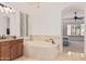Bathroom tub with vanity and view of bedroom at 1834 E Scorpio Pl, Chandler, AZ 85249