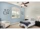 This bedroom is freshly painted with a ceiling fan and plantation shutters for privacy at 1834 E Scorpio Pl, Chandler, AZ 85249