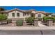 Attractive single-story home with desert landscaping, stone accents, and a welcoming entrance under a bright sky at 1834 E Scorpio Pl, Chandler, AZ 85249
