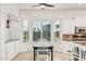 Eat-in kitchen features bright windows and a charming breakfast nook at 1834 E Scorpio Pl, Chandler, AZ 85249