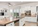 Kitchen features island with stainless steel sink and granite countertops at 1834 E Scorpio Pl, Chandler, AZ 85249