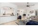 Spacious living room flowing into a bright kitchen with modern appliances at 1834 E Scorpio Pl, Chandler, AZ 85249