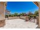 A spacious outdoor patio features stone pavers and metal accents, perfect for entertaining at 1834 E Scorpio Pl, Chandler, AZ 85249
