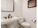 Stylish powder room features modern fixtures and pedestal sink at 1834 E Scorpio Pl, Chandler, AZ 85249