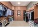 Large walk-in closet with built-in storage and carpet flooring at 1834 E Scorpio Pl, Chandler, AZ 85249