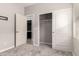 Bedroom featuring a closet with sliding doors and an open doorway to the en-suite bathroom at 19726 W Woodlands Ave, Buckeye, AZ 85326
