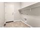 Laundry room with tile flooring, a utility sink hookups, and space for folding at 19726 W Woodlands Ave, Buckeye, AZ 85326