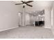 Spacious living room features neutral walls, new carpet and entryways to bedrooms and kitchen at 19726 W Woodlands Ave, Buckeye, AZ 85326