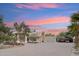 Charming desert home with a three-car garage, extended driveway, and well-maintained landscaping at 20041 W Pasadena Ave, Litchfield Park, AZ 85340