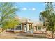 Beautiful desert home showcasing a meticulously landscaped yard and well-maintained front exterior at 20041 W Pasadena Ave, Litchfield Park, AZ 85340