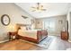 Spacious main bedroom with vaulted ceiling, wood-look flooring, and beautiful natural light at 20041 W Pasadena Ave, Litchfield Park, AZ 85340