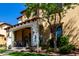 Charming home featuring a covered front porch, well-kept landscaping, and an attractive desert-inspired design at 21152 W Sunrise Ln, Buckeye, AZ 85396