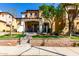 Charming two-story home with manicured lawn, covered porch, and appealing desert landscaping at 21152 W Sunrise Ln, Buckeye, AZ 85396
