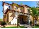 Beautiful home with a covered front porch, desert landscaping, and a charming, well-maintained exterior at 21152 W Sunrise Ln, Buckeye, AZ 85396