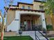 Charming home featuring a cozy front porch, stylish decor, and verdant landscaping at 21152 W Sunrise Ln, Buckeye, AZ 85396