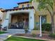 Inviting front porch with comfortable seating, decorative plants, and manicured landscaping at 21152 W Sunrise Ln, Buckeye, AZ 85396
