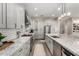 Well-lit kitchen featuring granite countertops, stainless steel appliances, gray cabinetry and subway tile backsplash at 21152 W Sunrise Ln, Buckeye, AZ 85396