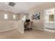 Open loft space perfect for a home office, with desk and adjacent bathroom at 21152 W Sunrise Ln, Buckeye, AZ 85396