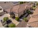 Up high view of a single story home featuring desert landscaping and a three car garage at 2116 E Beautiful Ln, Phoenix, AZ 85042