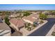 Aerial view of a suburban community, showcasing well-manicured lawns and a car parked in the driveway at 2116 E Beautiful Ln, Phoenix, AZ 85042