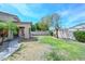 Spacious backyard with mature trees, desert landscaping, and room for outdoor entertaining at 2116 E Beautiful Ln, Phoenix, AZ 85042