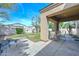 Backyard featuring extended patio, landscaping, and block wall at 2116 E Beautiful Ln, Phoenix, AZ 85042