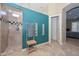 Bathroom view showcasing walk-in shower with tiled walls, a teal accent wall, and neutral finishes at 2116 E Beautiful Ln, Phoenix, AZ 85042