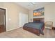 Bedroom with a large bed, neutral walls, and a closet with sliding doors at 2116 E Beautiful Ln, Phoenix, AZ 85042