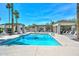 Relaxing community pool area with inviting lounges, shaded pergola, and refreshing water features at 2116 E Beautiful Ln, Phoenix, AZ 85042
