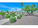 Stunning community pool area with lush landscaping, shaded seating, and refreshing water features at 2116 E Beautiful Ln, Phoenix, AZ 85042