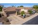 Charming home exterior with a well-manicured lawn and desert landscaping at 2116 E Beautiful Ln, Phoenix, AZ 85042