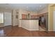 Open kitchen with stainless steel appliances and a breakfast bar for casual dining at 2116 E Beautiful Ln, Phoenix, AZ 85042