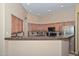 Stylish kitchen with granite countertops, stainless steel appliances, and lots of cabinets at 2116 E Beautiful Ln, Phoenix, AZ 85042
