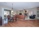 Open-concept living space with hardwood floors, carpet and fireplace with lots of natural light at 2116 E Beautiful Ln, Phoenix, AZ 85042