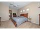 Spacious bedroom with ceiling fan, recessed lighting, and an open doorway at 2116 E Beautiful Ln, Phoenix, AZ 85042