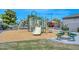 Community playground with colorful equipment, a picnic table, and a soft surface for safe play at 2116 E Beautiful Ln, Phoenix, AZ 85042