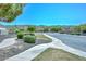 Charming street view with winding sidewalks and lush green spaces, blending nature and neighborhood at 2116 E Beautiful Ln, Phoenix, AZ 85042
