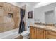 Bathroom showcasing a tiled shower with a rainfall showerhead and a granite countertop vanity at 21470 E Orchard Ln, Queen Creek, AZ 85142