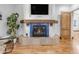Close-up of the fireplace and mantel, with flatscreen TV above at 21470 E Orchard Ln, Queen Creek, AZ 85142
