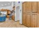 Kitchen with custom wood cabinets, stainless appliances, and large open pantry space at 21470 E Orchard Ln, Queen Creek, AZ 85142