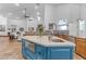 Spacious kitchen island with white countertops and stainless steel appliances in a modern kitchen at 21470 E Orchard Ln, Queen Creek, AZ 85142