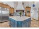 Kitchen with large island, custom cabinets, and stainless steel appliances at 21470 E Orchard Ln, Queen Creek, AZ 85142
