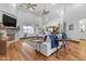 Spacious living area with fireplace, hardwood floors, and neutral decor at 21470 E Orchard Ln, Queen Creek, AZ 85142