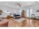 Bright and airy bedroom with wood floors, plantation shutters, and seating area at 21470 E Orchard Ln, Queen Creek, AZ 85142