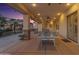 Covered outdoor patio featuring a ping pong table for entertainment at 21470 E Orchard Ln, Queen Creek, AZ 85142